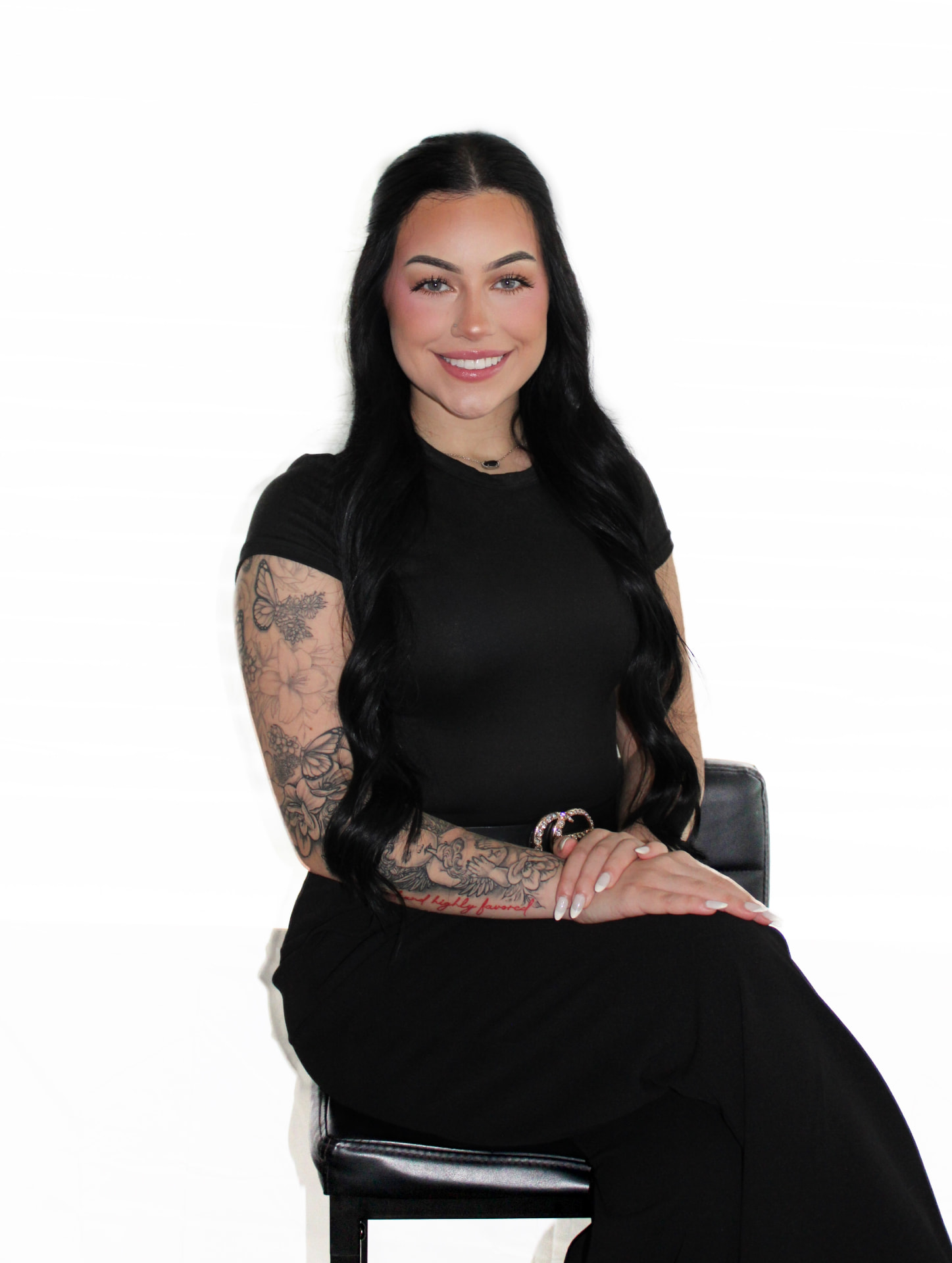 Kam of Iconic by Kam holding her professional lash tweezers