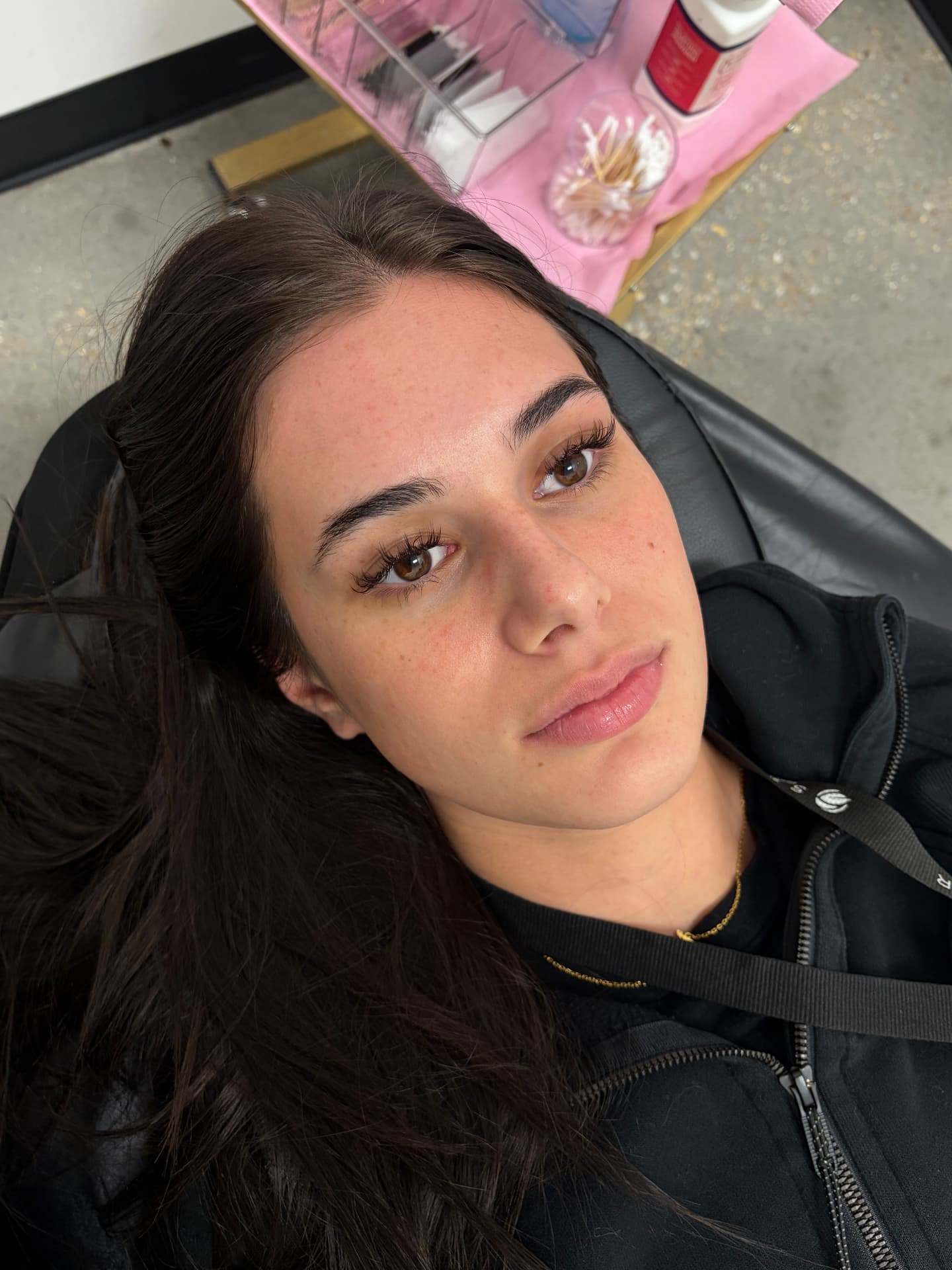 Brow sculpt before and after — long dark hair client — before