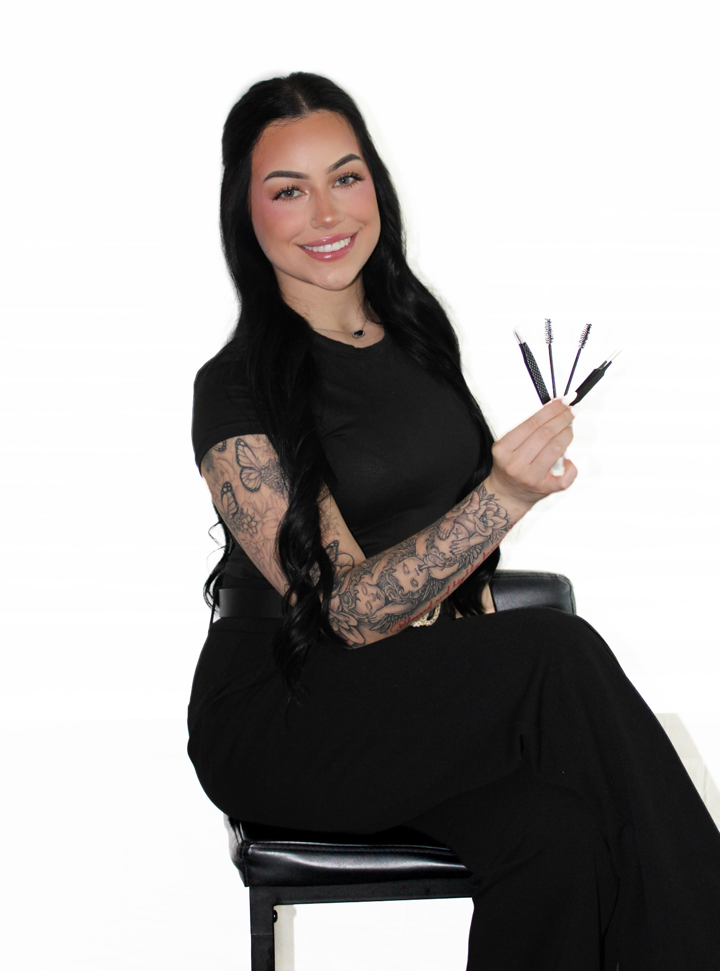 Kam seated with Cashmere lash extension trays