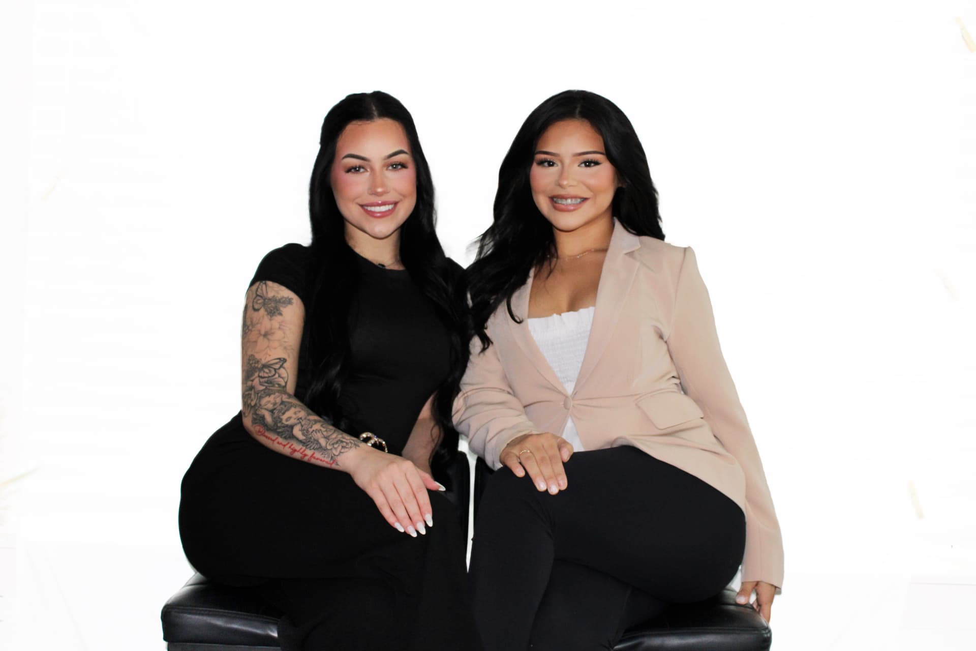 Kam and Isabelle seated together in the studio